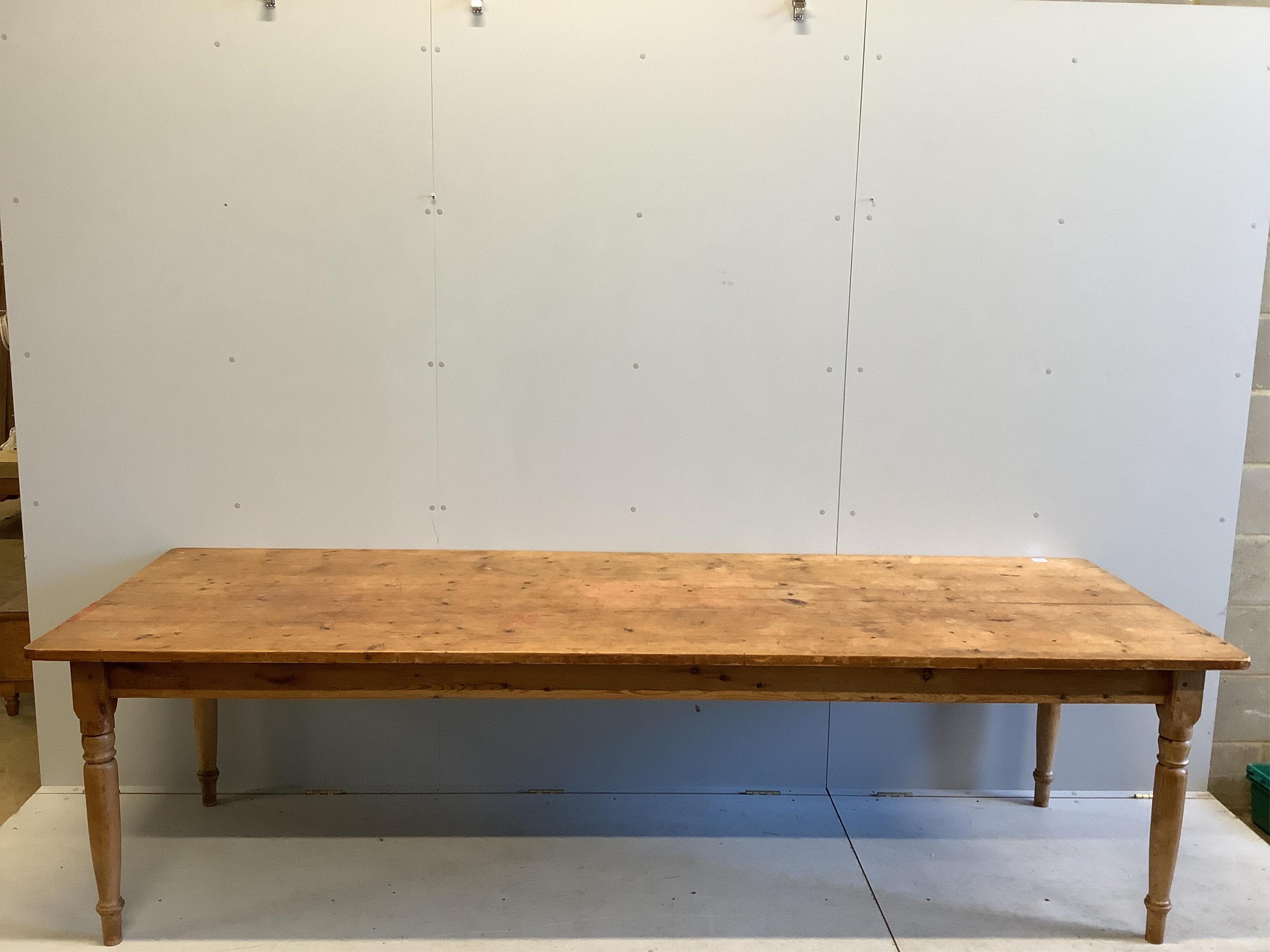 A Victorian rectangular pine kitchen table, fitted two drawers, width 275cm, depth 92cm, height 75cm. Condition - fair to good